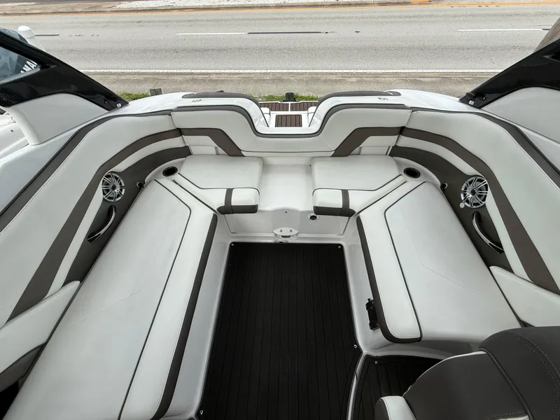 Slide: The Image of 2016 Yamaha Boats 242 Limited S E-Series interior with spacious seating and sleek design. - 18