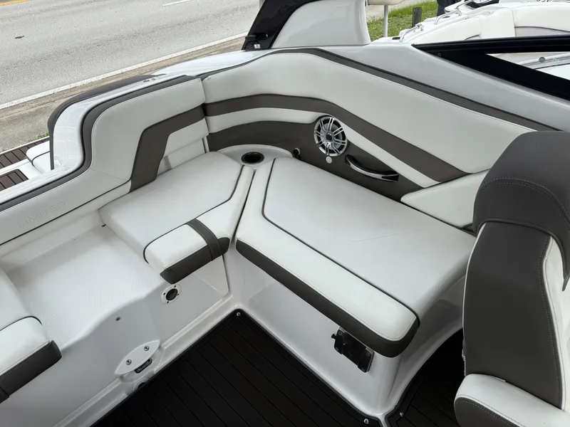 Slide: The Image of 2016 Yamaha Boats 242 Limited S E-Series interior with sleek white and gray seating. - 19
