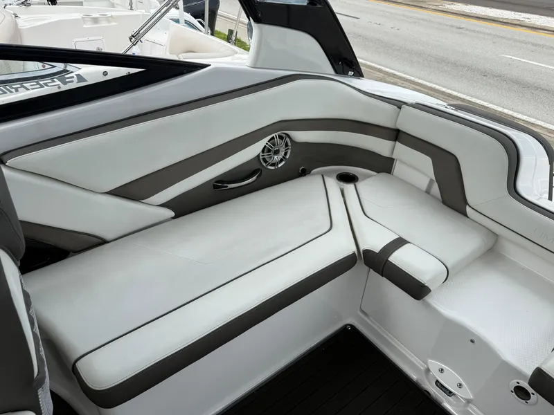 Slide: The Image of 2016 Yamaha Boats 242 Limited S E-Series interior seating with sleek design and speaker system. - 20