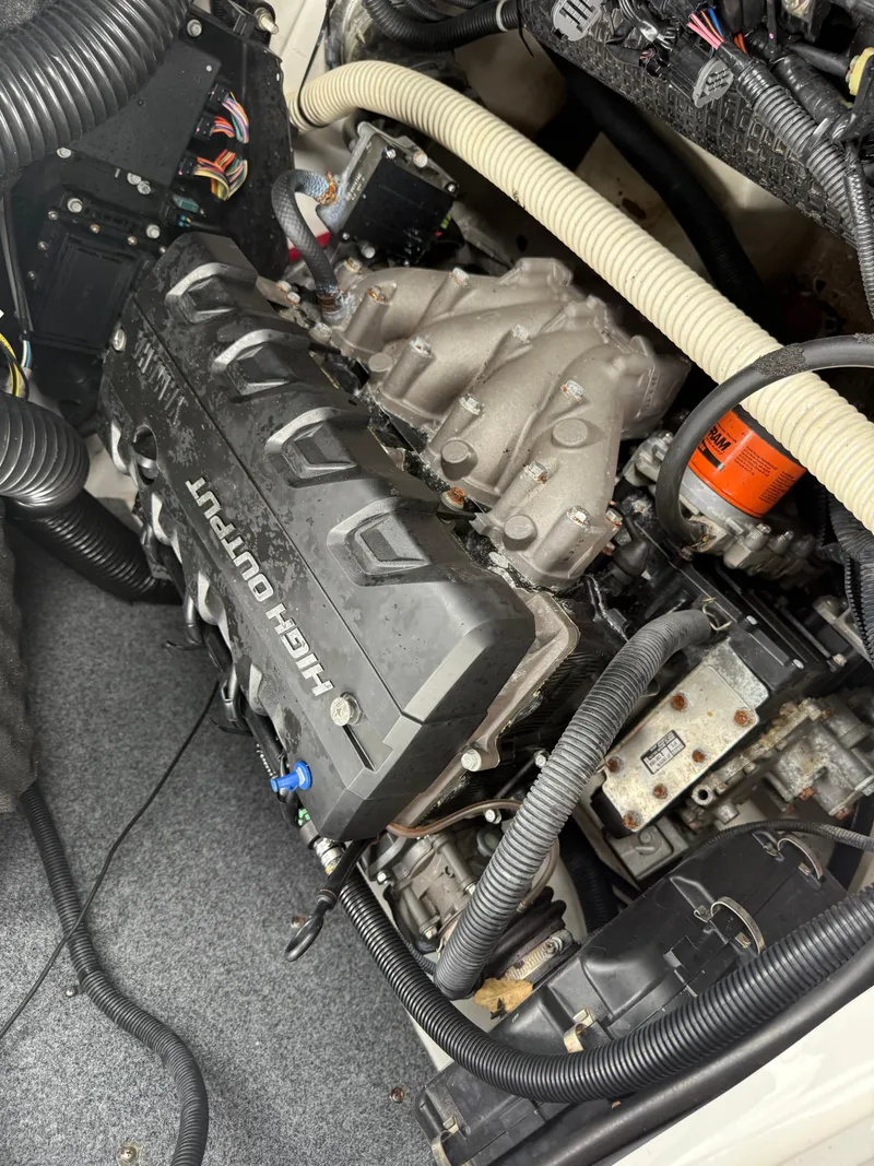 Slide: The Image of Engine compartment of a 2016 Yamaha Boats 242 Limited S E-Series, showcasing mechanical components. - 22