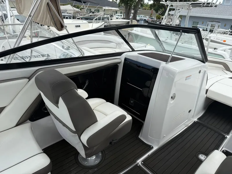 Slide: The Image of 2016 Yamaha Boats 242 Limited S E-Series interior with sleek seating and modern dashboard. - 28