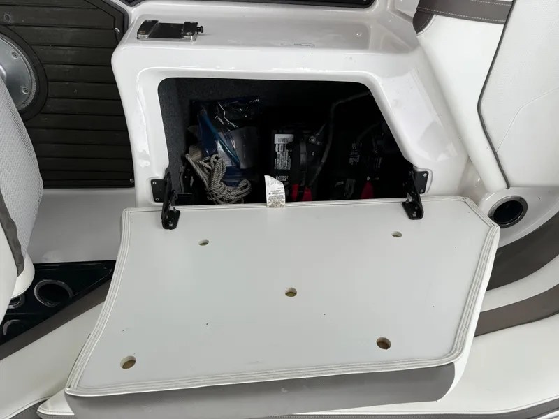 Slide: The Image of Open storage compartment in 2016 Yamaha Boats 242 Limited S E-Series. - 29