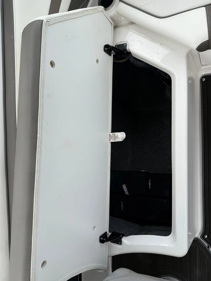 Slide: The Image of Open storage compartment on a 2016 Yamaha Boats 242 Limited S E-Series. - 30
