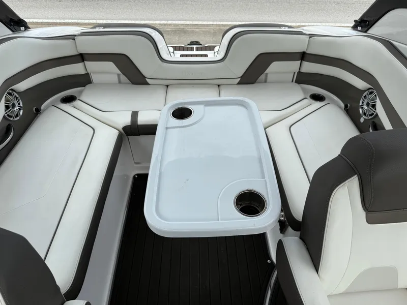 Slide: The Image of 2016 Yamaha Boats 242 Limited S E-Series interior with seating and table. - 33