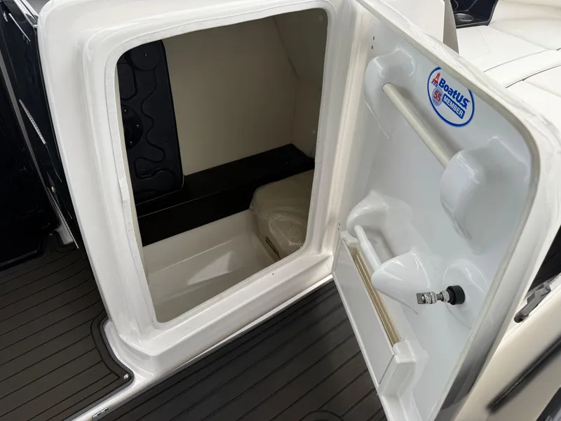 Slide: The Image of Open storage compartment on 2016 Yamaha Boats 242 Limited S E-Series. - 34
