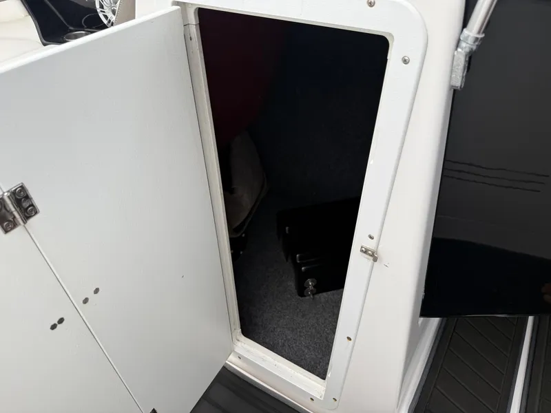 Slide: The Image of Open storage compartment on 2016 Yamaha Boats 242 Limited S E-Series. - 39