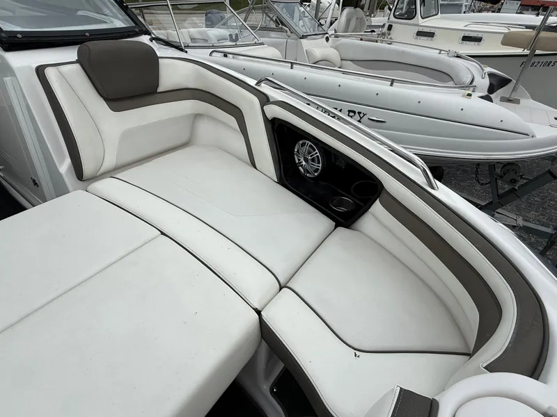Slide: The Image of 2016 Yamaha Boats 242 Limited S E-Series interior with white cushioned seating. - 42