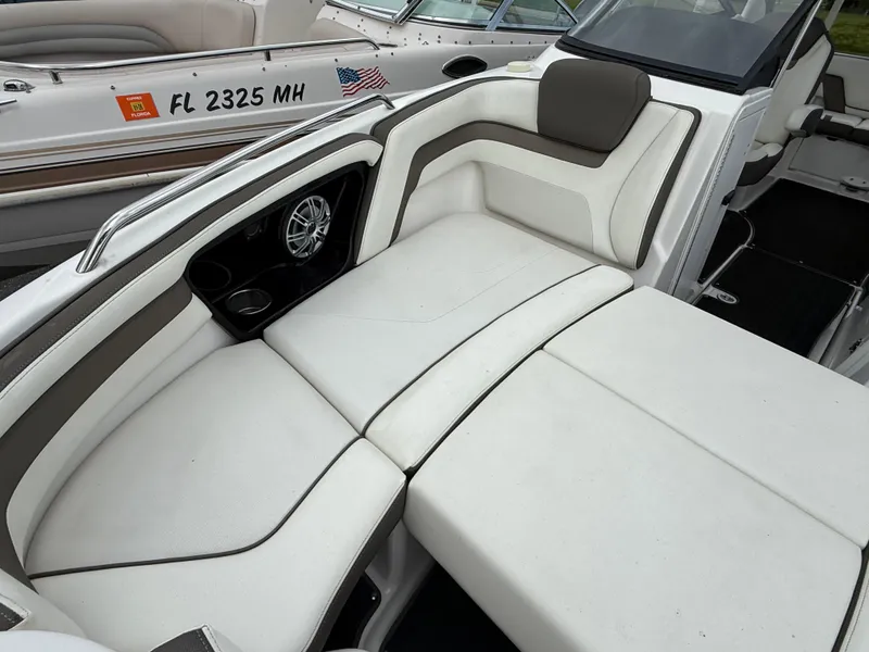 Slide: The Image of 2016 Yamaha Boats 242 Limited S E-Series interior with white cushioned seating. - 43