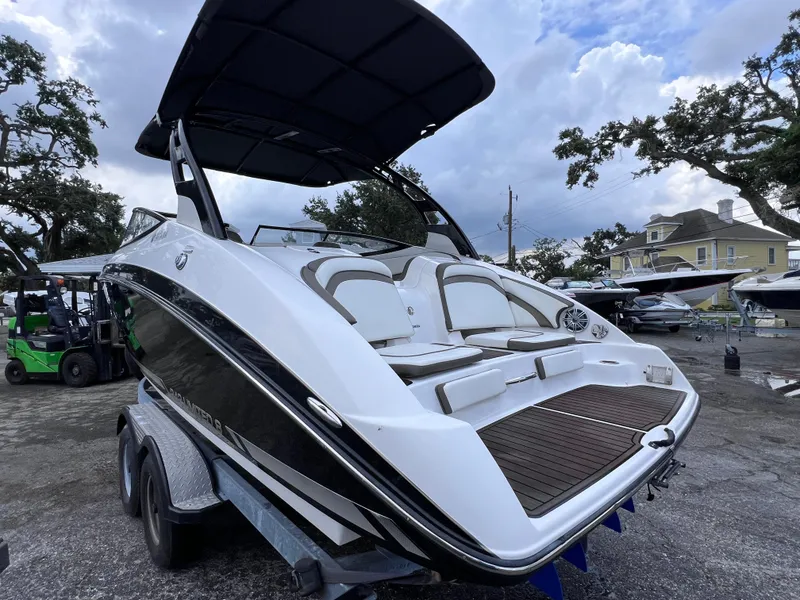 Slide: The Image of 2016 Yamaha Boats 242 Limited S E-Series on trailer, parked outdoors. - 4