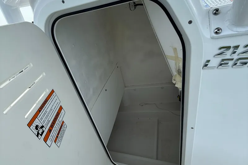 Slide: The Image of Open storage compartment on a 2025 NauticStar 212 Legacy boat. - 15