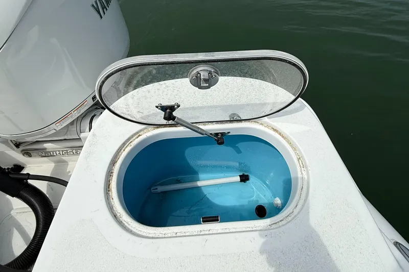 Slide: The Image of Open livewell on 2025 NauticStar 212 Legacy boat, showcasing interior design. - 21