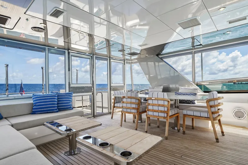Slide: The Image of Luxurious interior of 2019 Hatteras M90 Panacera yacht with ocean view and elegant seating. - 10