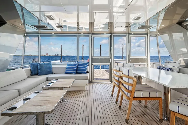 Slide: The Image of Luxurious interior of 2019 Hatteras M90 Panacera yacht with ocean view and elegant seating. - 11