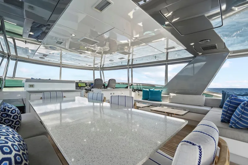 Slide: The Image of Luxurious interior of 2019 Hatteras M90 Panacera yacht with modern seating and ocean view. - 12