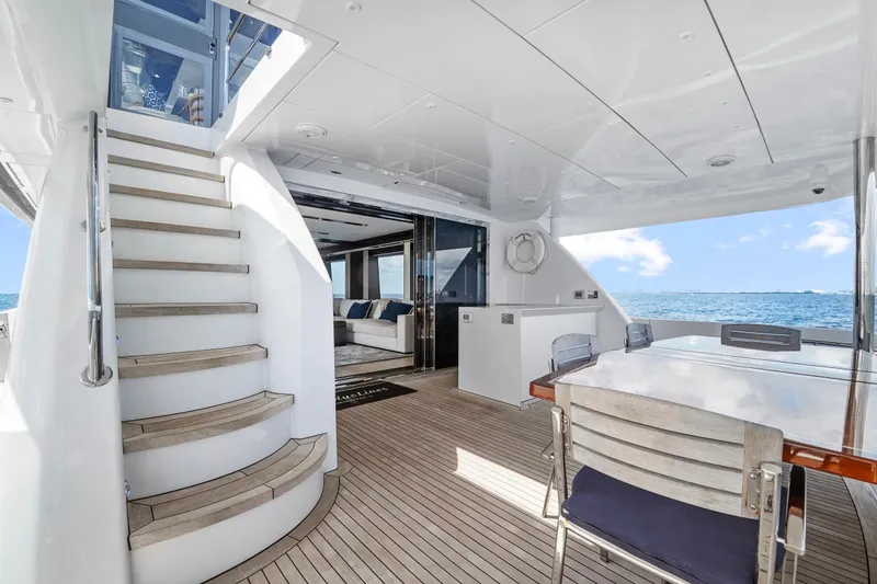 Slide: The Image of Luxurious 2019 Hatteras M90 Panacera yacht interior with elegant seating and ocean view. - 16