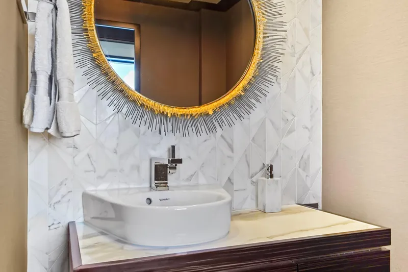 Slide: The Image of Luxurious bathroom in 2019 Hatteras M90 Panacera yacht with elegant round mirror. - 18