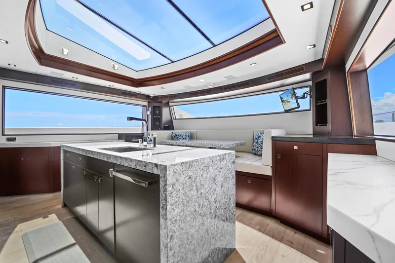 Slide: The Image of Luxurious interior of 2019 Hatteras M90 Panacera yacht with skylight and modern kitchen. - 21