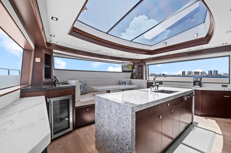 Slide: The Image of Luxurious interior of 2019 Hatteras M90 Panacera yacht with skylight and modern kitchen. - 22