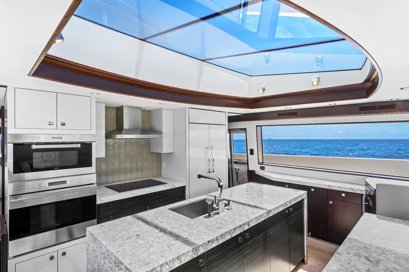 Slide: The Image of Luxurious kitchen interior of 2019 Hatteras M90 Panacera yacht with ocean view and skylight. - 24