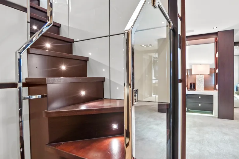 Slide: The Image of Luxurious interior of 2019 Hatteras M90 Panacera yacht with elegant staircase and modern decor. - 25