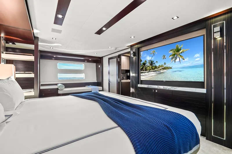 Slide: The Image of Luxurious 2019 Hatteras M90 Panacera yacht bedroom with ocean view and modern decor. - 27