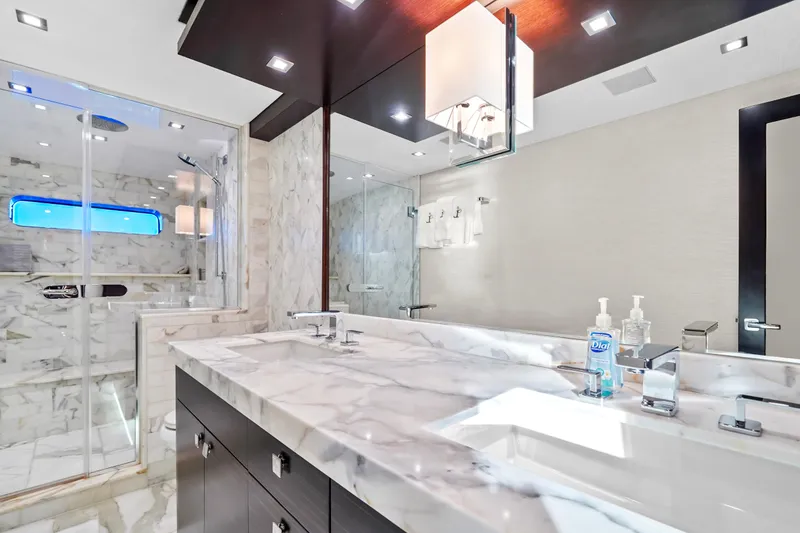 Slide: The Image of Luxurious marble bathroom in 2019 Hatteras M90 Panacera yacht with dual sinks and modern shower. - 28
