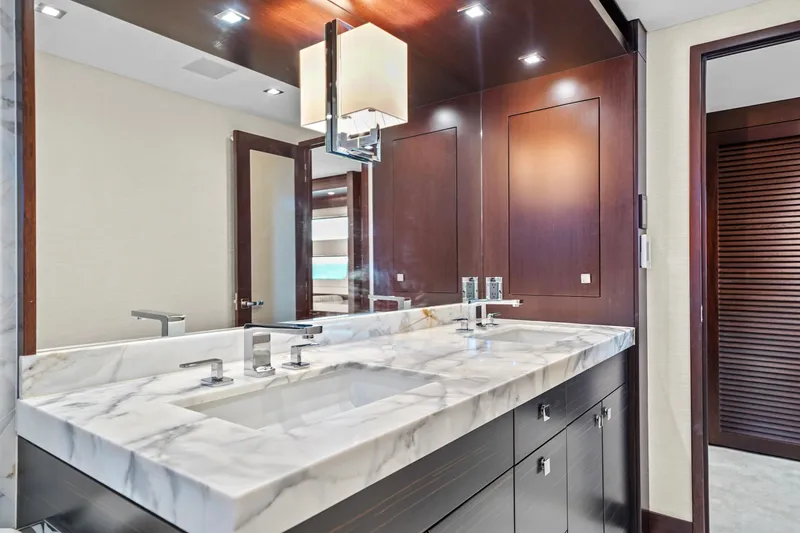 Slide: The Image of Luxurious bathroom with marble countertop in 2019 Hatteras M90 Panacera yacht. - 29
