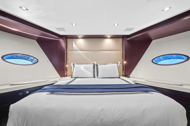 Slide: The Image of Luxurious bedroom interior of 2019 Hatteras M90 Panacera yacht with modern design and porthole windows. - 32