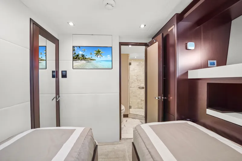 Slide: The Image of Luxurious 2019 Hatteras M90 Panacera yacht cabin with twin beds and modern decor. - 36
