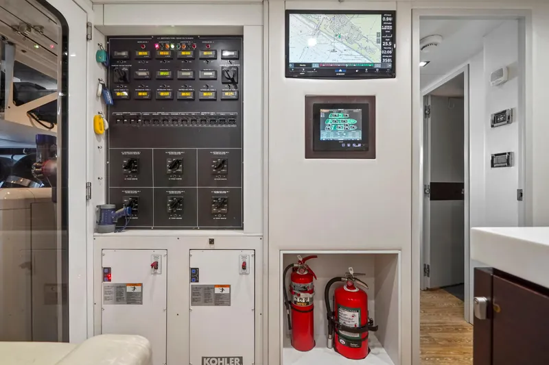 Slide: The Image of Control panel and safety equipment inside 2019 Hatteras M90 Panacera yacht. - 38