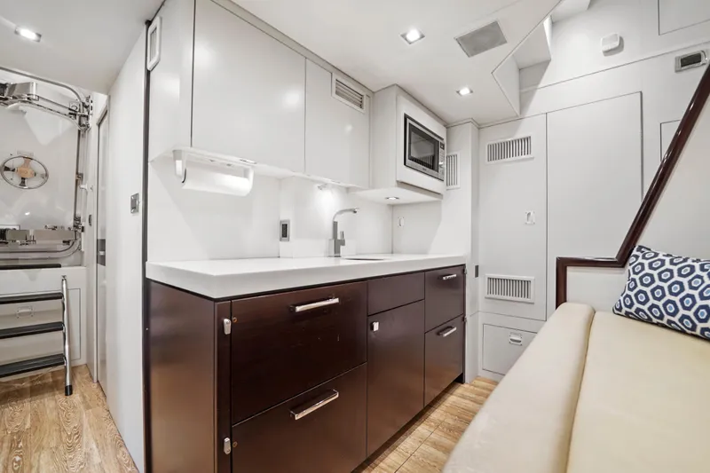 Slide: The Image of Luxurious 2019 Hatteras M90 Panacera yacht interior with modern kitchen and seating area. - 39