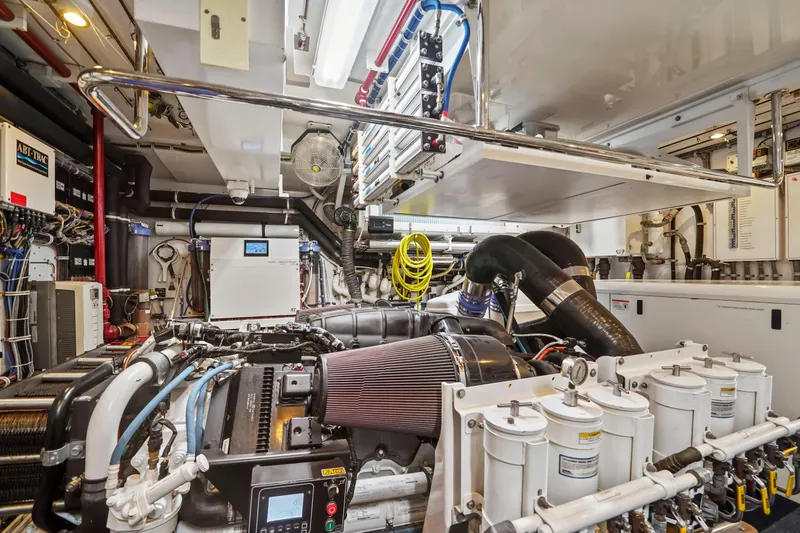 Slide: The Image of Engine room of 2019 Hatteras M90 Panacera yacht, showcasing advanced machinery and equipment. - 44