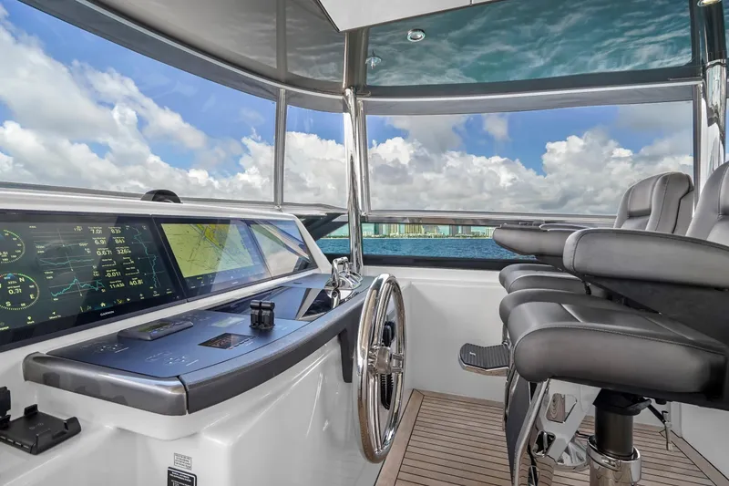 Slide: The Image of Luxurious helm of 2019 Hatteras M90 Panacera yacht with advanced navigation displays. - 5