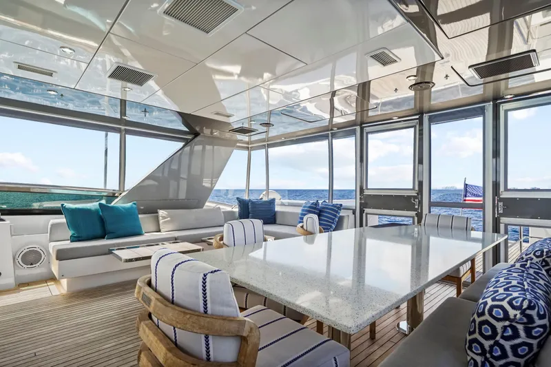 Slide: The Image of Luxurious interior of 2019 Hatteras M90 Panacera yacht with ocean view and elegant seating. - 9