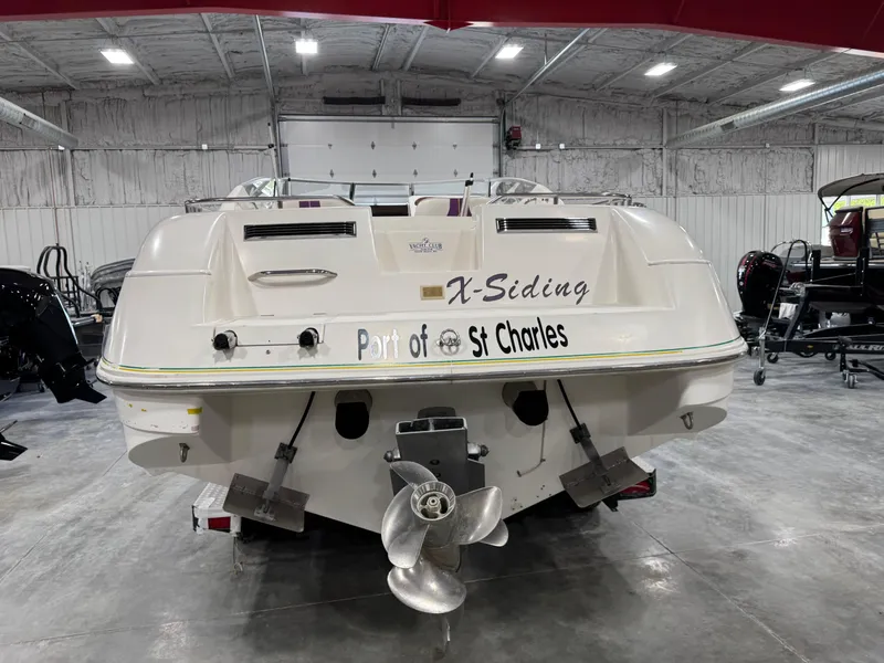 Slide: The Image of 1997 Thompson Torrent 2900 boat in a garage, labeled "X-Siding," Port of St. Charles. - 5