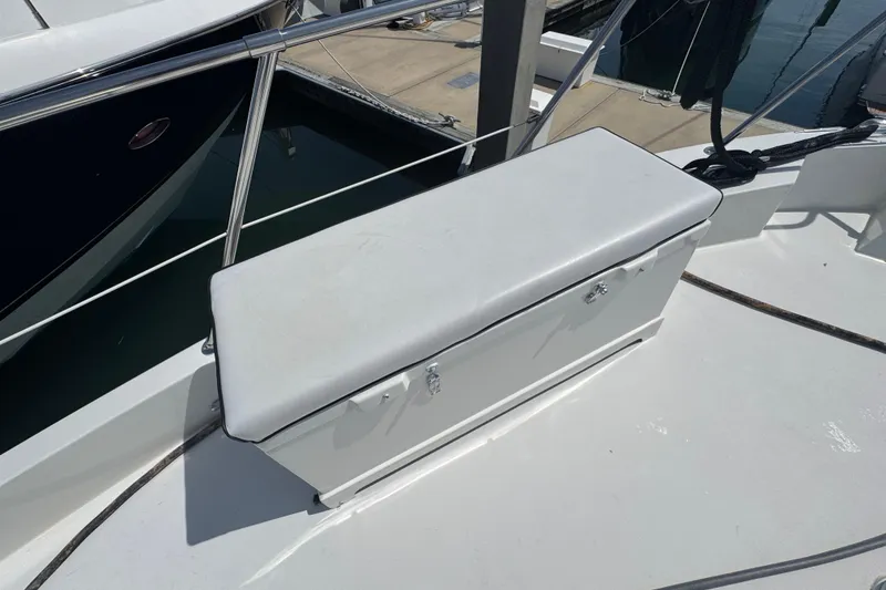 Slide: The Image of Bench seat on 1995 Hatteras 74 Cockpit Motor Yacht deck, near marina. - 10