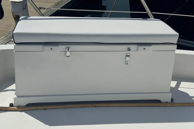 Slide: The Image of Storage box on 1995 Hatteras 74 Cockpit Motor Yacht deck, secured with metal latches. - 11