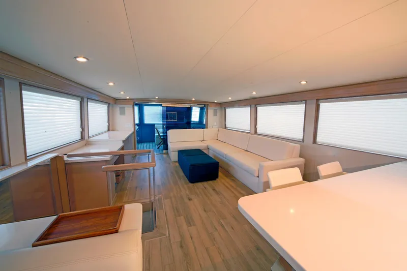 Slide: The Image of Luxurious interior of 1995 Hatteras 74 Cockpit Motor Yacht with modern furnishings. - 15