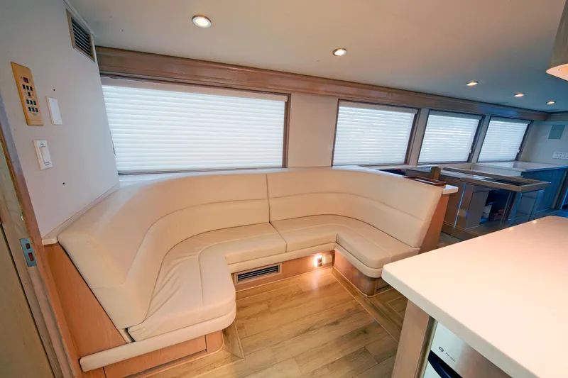 Slide: The Image of Luxurious interior of 1995 Hatteras 74 Cockpit Motor Yacht with elegant seating and modern design. - 27
