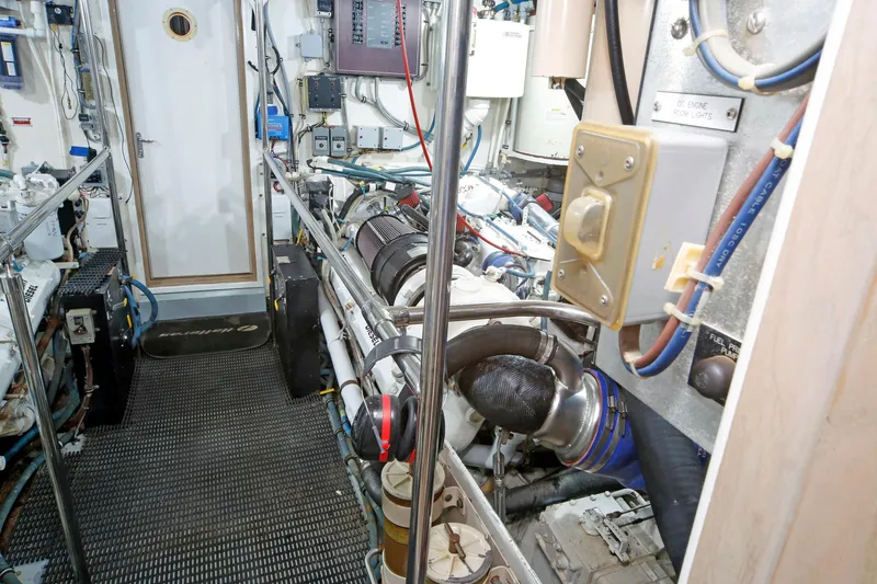 Slide: The Image of Engine room of 1995 Hatteras 74 Cockpit Motor Yacht, showcasing machinery and equipment. - 30