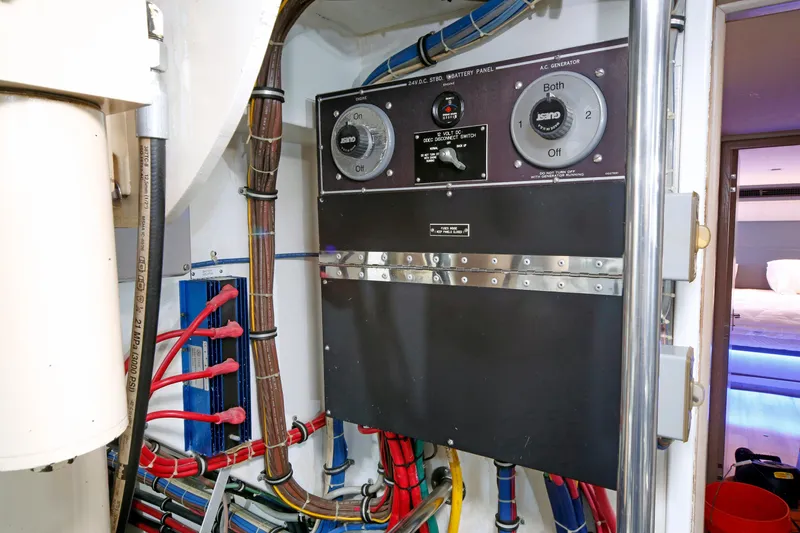 Slide: The Image of Electrical panel and wiring inside a 1995 Hatteras 74 Cockpit Motor Yacht. - 36
