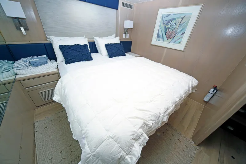 Slide: The Image of Cozy bedroom in 1995 Hatteras 74 Cockpit Motor Yacht with nautical decor. - 51