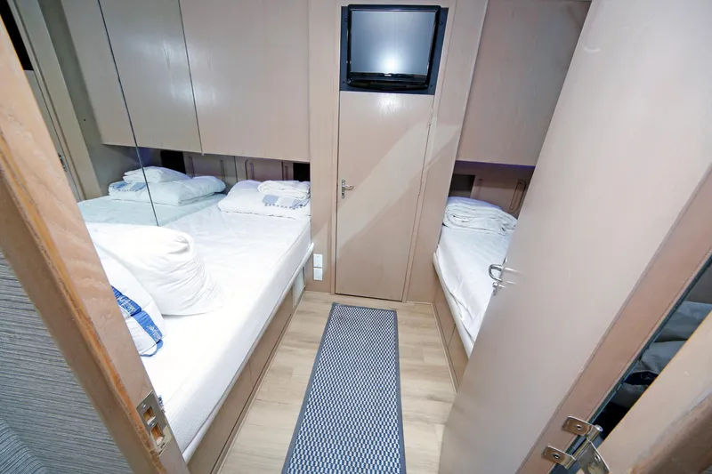 Slide: The Image of Interior cabin of 1995 Hatteras 74 Cockpit Motor Yacht with twin beds and TV. - 55
