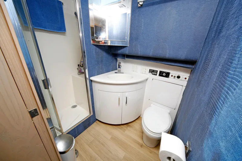 Slide: The Image of Bathroom interior of 1995 Hatteras 74 Cockpit Motor Yacht with shower and toilet. - 56