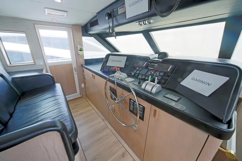 Slide: The Image of Cockpit of 1995 Hatteras 74 Cockpit Motor Yacht with Garmin navigation system. - 59