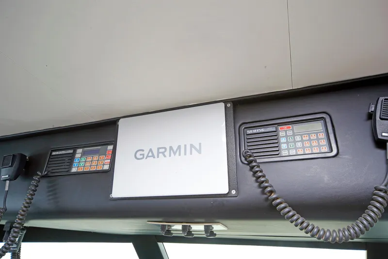 Slide: The Image of Control panel of 1995 Hatteras 74 Cockpit Motor Yacht with Garmin navigation system. - 61