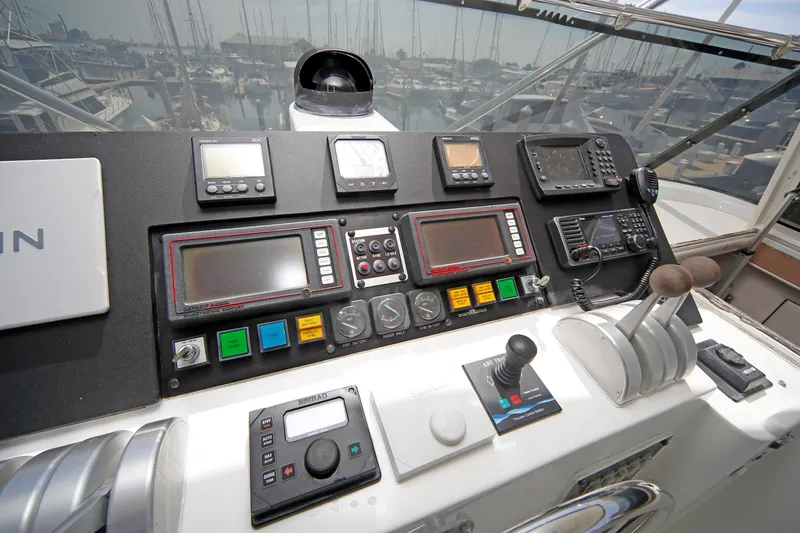 Slide: The Image of Control panel of a 1995 Hatteras 74 Cockpit Motor Yacht with navigation instruments. - 63