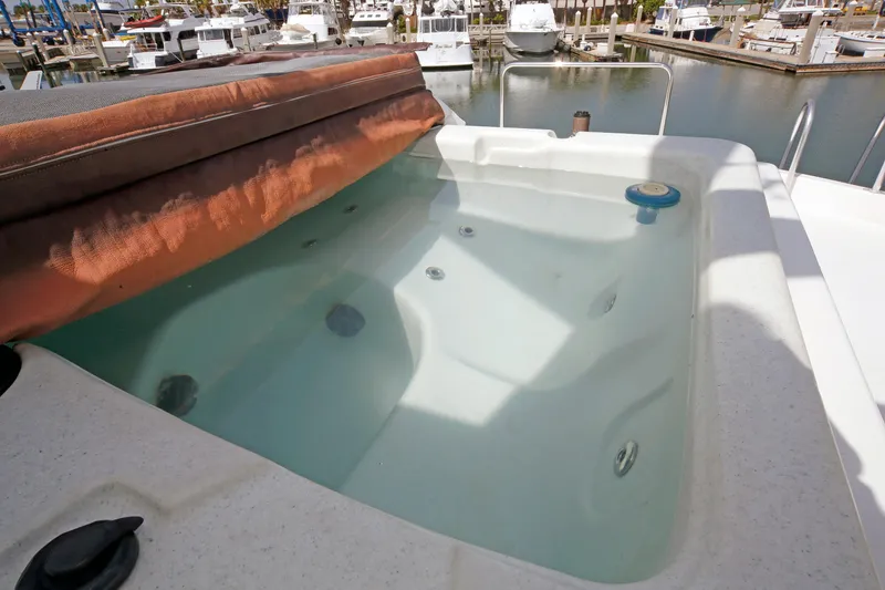 Slide: The Image of Jacuzzi on 1995 Hatteras 74 Cockpit Motor Yacht, docked at marina. - 72