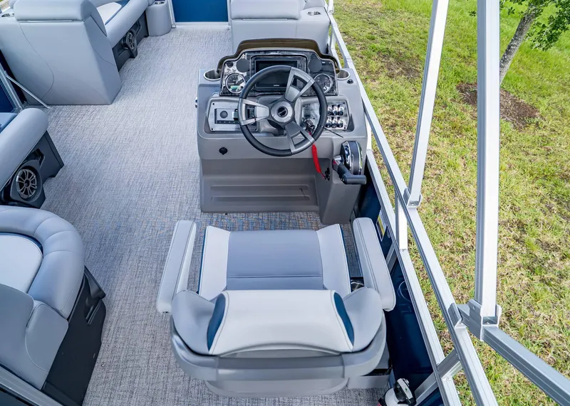 Slide: The Image of 2025 Tahoe SPORTS 85 REAR FISH boat interior with steering console and seating. - 10