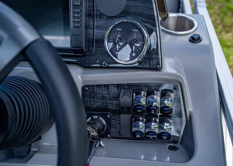 Slide: The Image of Dashboard of 2025 Tahoe SPORTS 85 REAR FISH boat with controls and gauges. - 12